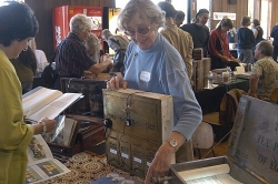 Artist Diane Cassidy demonstrates one of her creations, made from an old letterbox