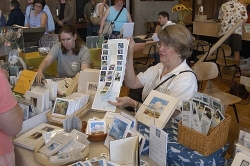 Artist Karin Schulz explains her work to a visitor