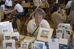 Karin Schulz shows off some of her books, cards and etchings