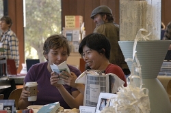 Artist Peng-Peng Wang and a friend enjoy a handmade book