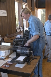 Dave Robison of the Printer's Guild at History Park, San Jose, works on one of the Multigraph printers they brought to the Book Arts Jam