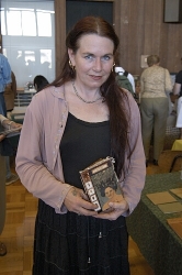 Artist Robin Rule displays one of her handmade one-of-a-kind books, Ick Bugs Artist Robin Rule displays one of her handmade one-of-a-kind books, Ick Bugs