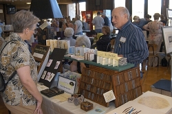 Phillip Morrison of Shoestring Press discusses his work with a Book Arts Jam visitor