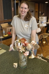 Kara Sjoblom-Bay poses with her bridal "book-quet" - each flower/book was created by a member of Bay Area Book Artists