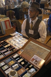 Peter Thomas shows some of the miniature editions made with his wife Donna Peter Thomas shows some of the miniature editions made with his wife Donna