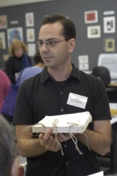 Ben Colborn holding a text block