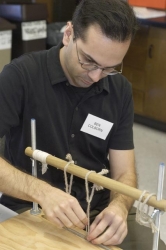 Ben Colborn settig up a sewing frame.